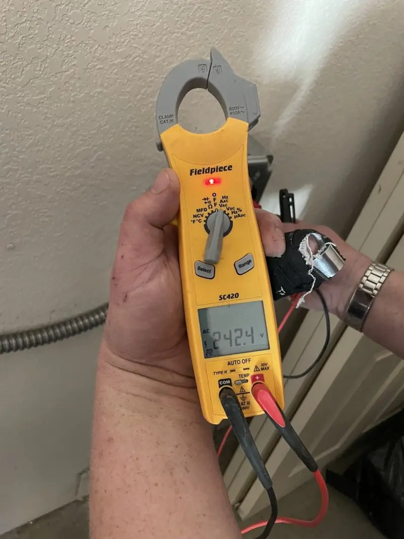 Voltage testing with clamp meter during Ceiling Fan Installation in Annapolis Neck